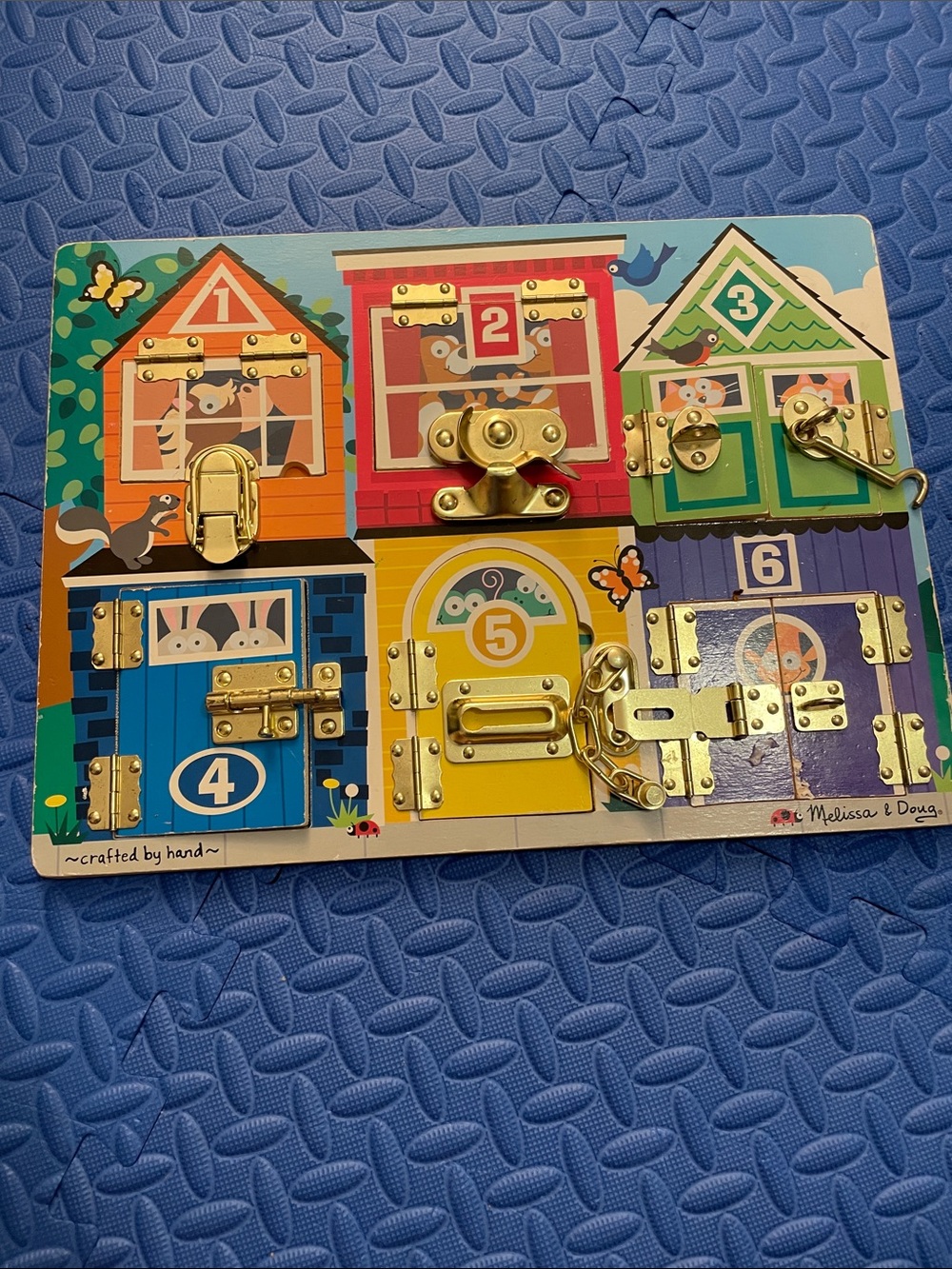 Melissa & Doug Kids' Latch Board Busy Board – Multi Color